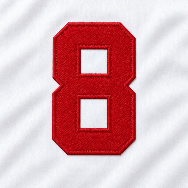 Close-up product mockup of the red embroidered number 8, showing raised stitched edges and white jersey fabric.