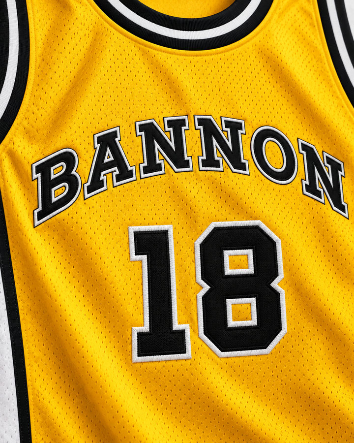 Embroidery detail product mockup of Scott Braddock 18 Bannon High School Basketball Jersey Jeepers Creepers 2, showing raised applique edges, fine stitching and fabric texture.