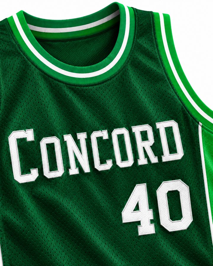 Neckline and chest detail product mockup of Shawn Kemp 40 Concord High School Minutemen Green Basketball Jersey, showing ribbed trim, seams and stitched lettering.
