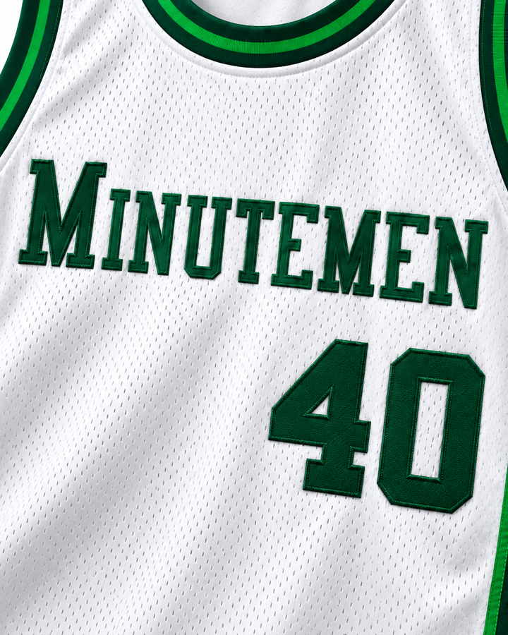 Embroidery detail product mockup of Shawn Kemp 40 Concord High School Minutemen White Basketball Jersey, showing raised applique edges, fine stitching and fabric texture.