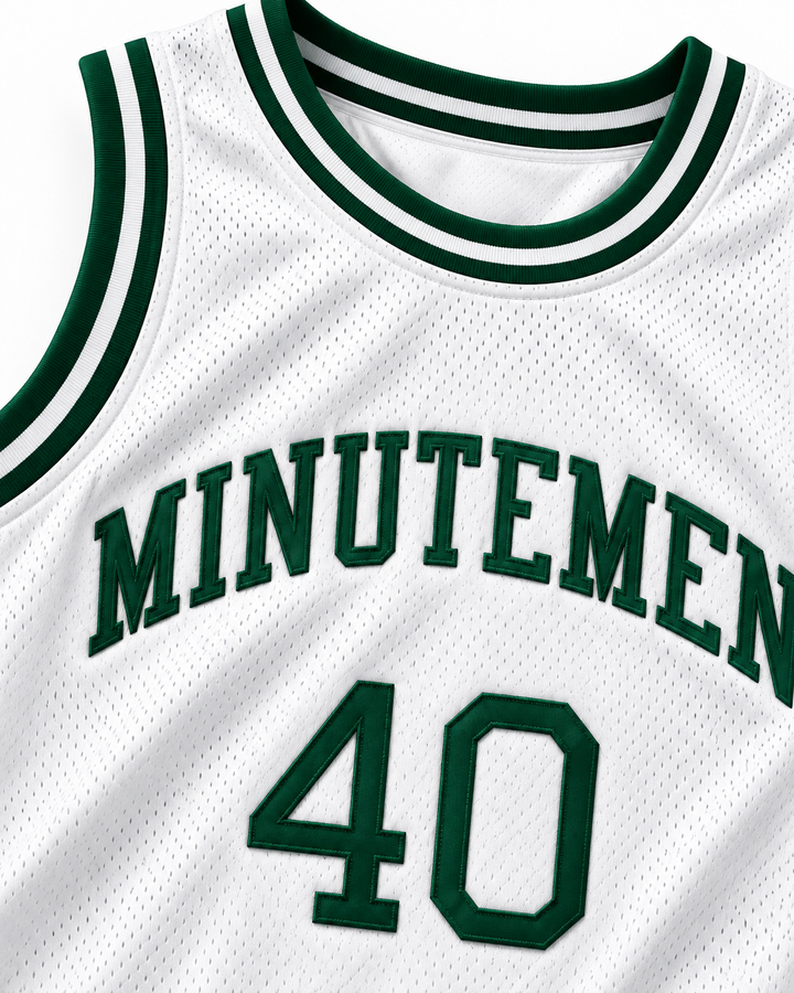 Neckline and chest detail product mockup of Shawn Kemp 40 Concord Minutemen High School Home Basketball Jersey, showing ribbed trim, seams and stitched lettering.
