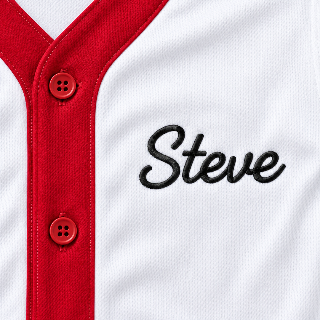 Close-up product mockup of black Steve script embroidery beside two red buttons on a white baseball jersey.