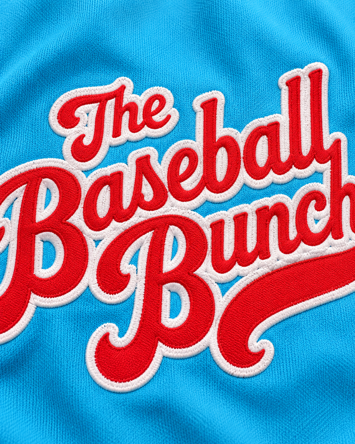 Embroidery detail product mockup of The Baseball Bunch Light Blue Baseball Jersey.