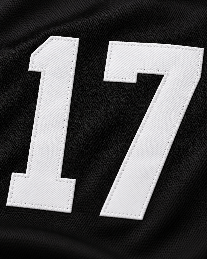 Embroidery detail product mockup of Tom Peterson 17 Aardvarks Rock N' Jock 1990 Baseball Jersey.