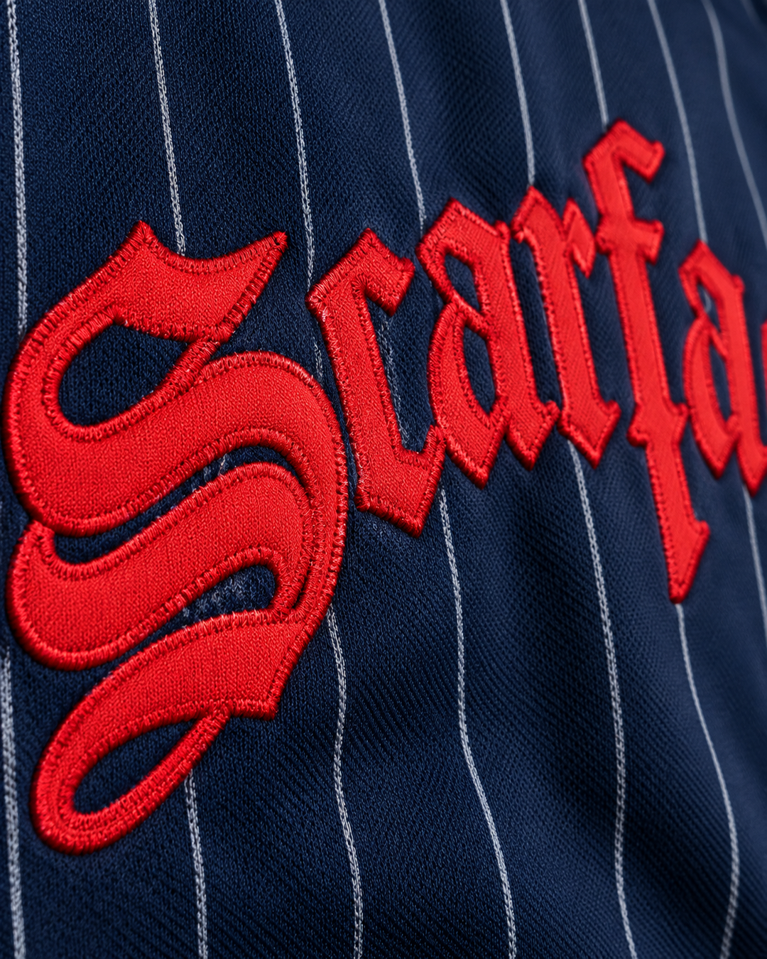 Embroidery detail product mockup of Tony Montana 83 Scarface Navy Blue Pinstriped Baseball Jersey.