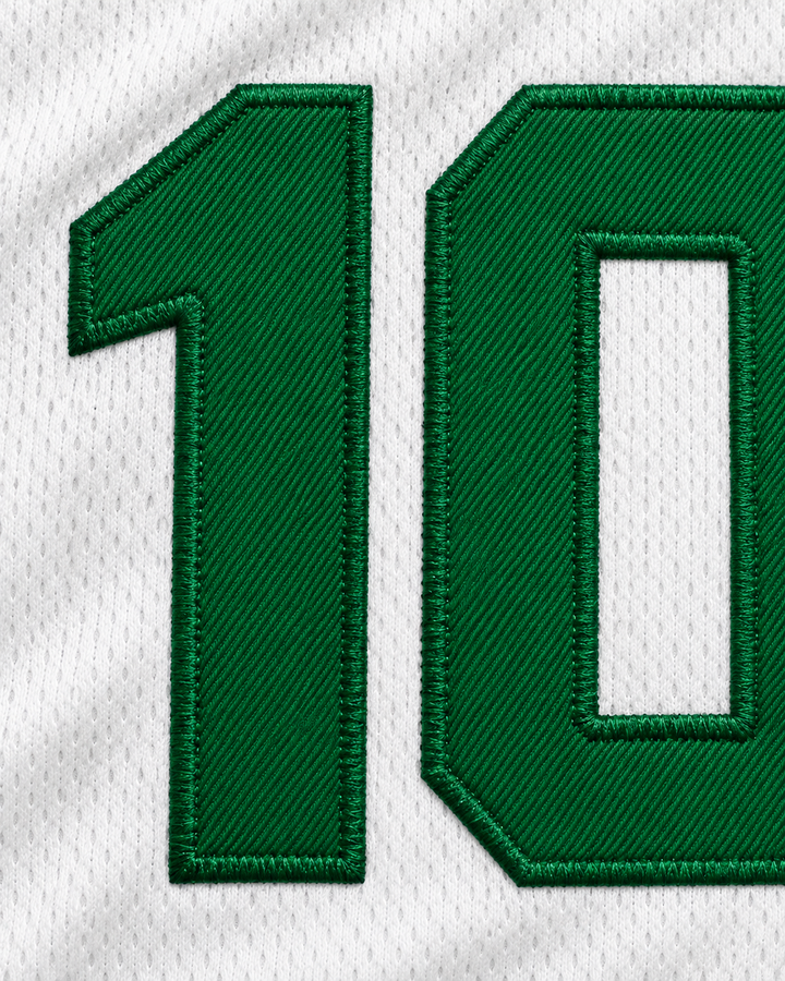 Embroidery detail product mockup of Unicaja Baloncesto Malaga Spain 10 White Basketball Jersey.