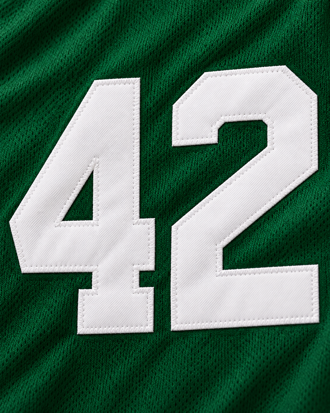 Embroidery detail product mockup of Vin Baker 42 Pyongyang Green Basketball Jersey.