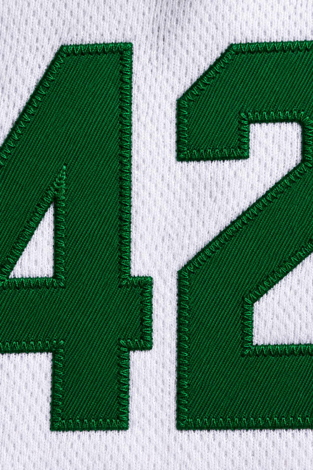 Embroidery detail product mockup of Vin Baker 42 Pyongyang White Basketball Jersey.