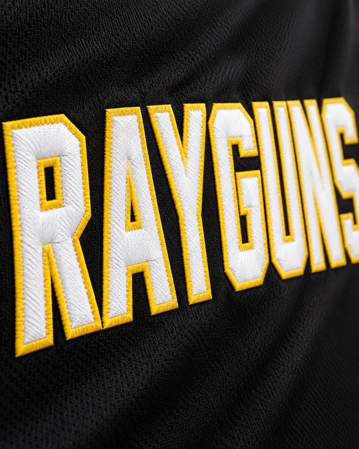 Embroidery detail product mockup of Vince Carter 15 Roswell Rayguns Black Basketball Jersey.