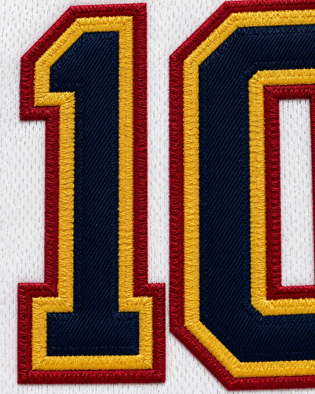 Embroidery detail product mockup of Virtus Roma 10 White Basketball Jersey.