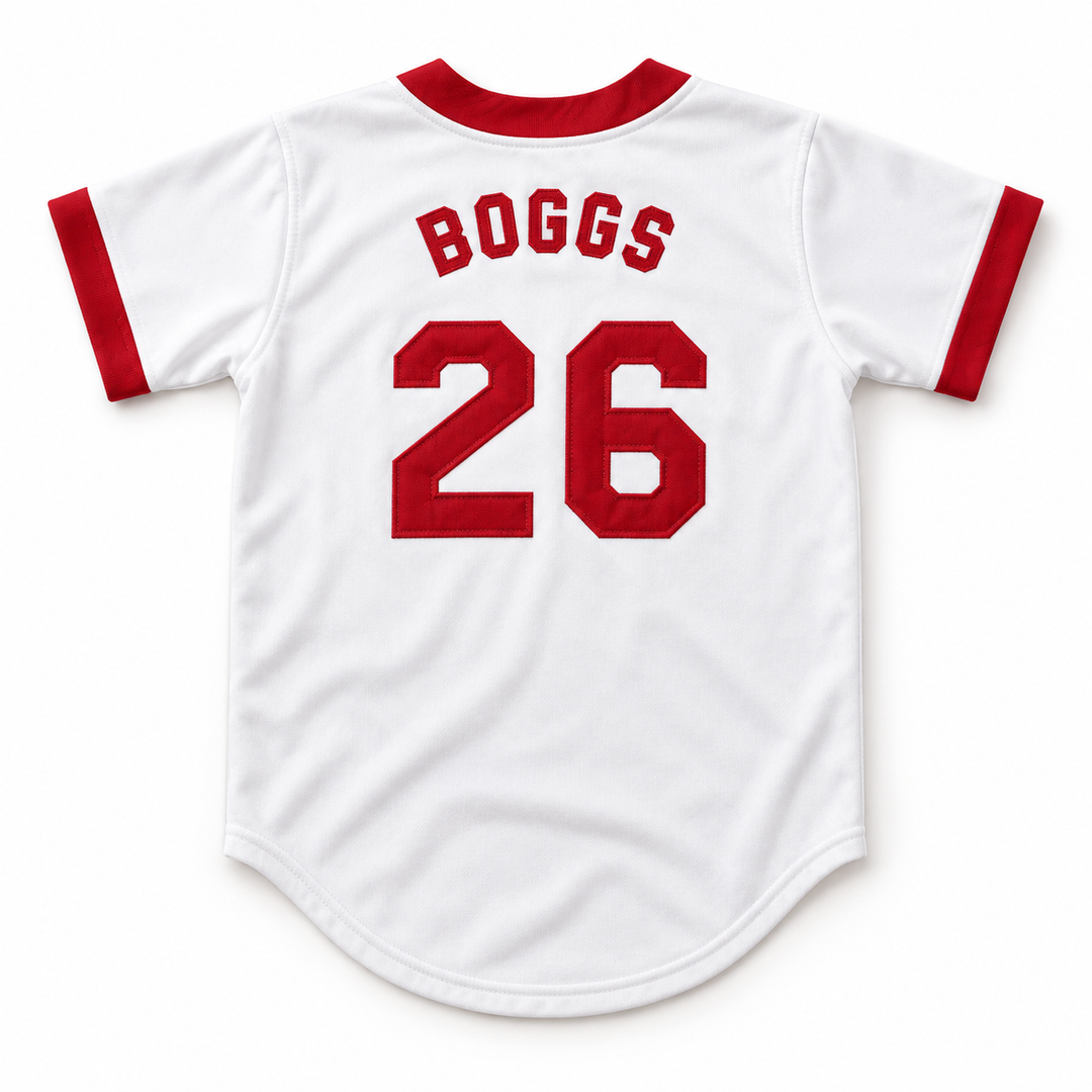 Back product mockup of a white baseball jersey with red BOGGS lettering, embroidered number 26 and red sleeve trim.
