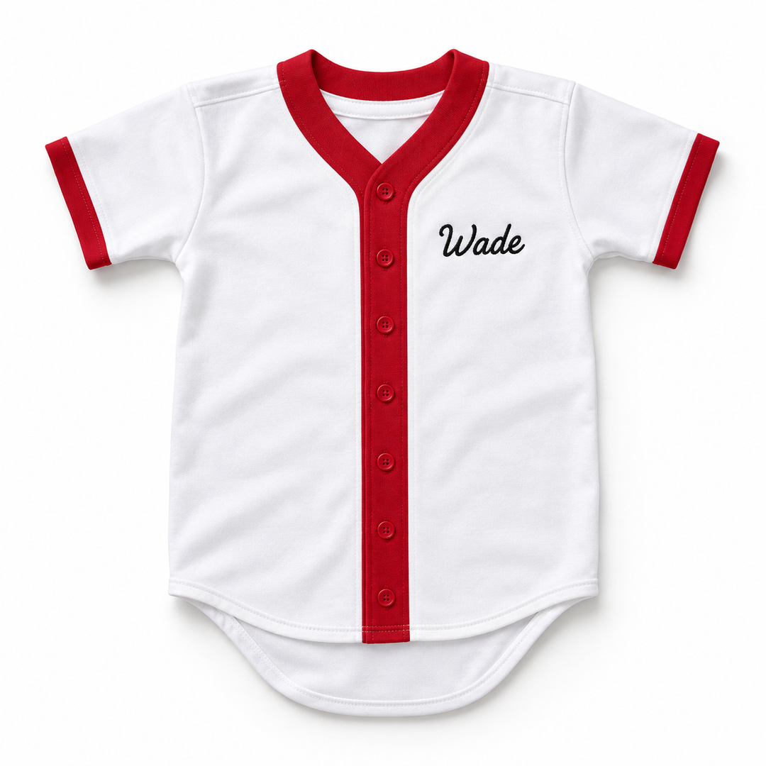 Front product mockup of a white Wade Boggs baseball jersey with red trim, seven red buttons and black Wade chest embroidery.