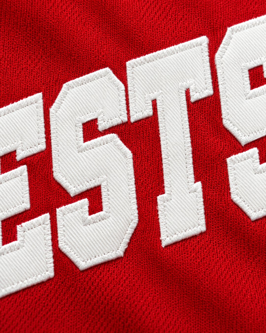 Embroidery detail product mockup of Westsiders 1 Red Rucker Park Basketball Jersey.