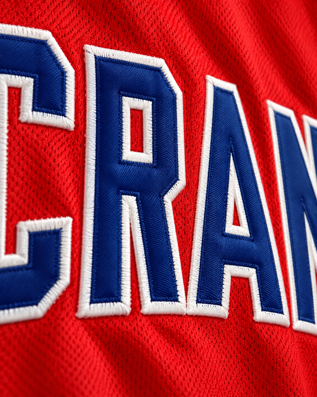 Embroidery detail product mockup of Will Bynum 3 Crane High School Cougars Red Basketball Jersey.