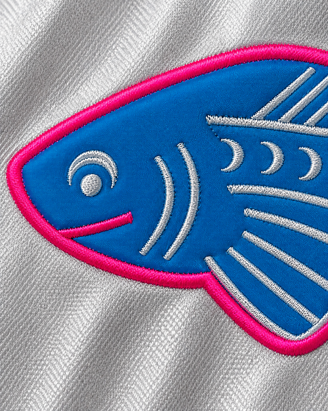Embroidery detail product mockup of Winston Running Hawk 46 Pisces Basketball Jersey.