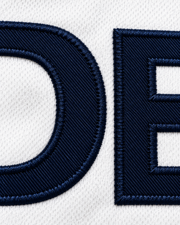 Embroidery detail product mockup of Yushkin 4 BC Odessa Ukraine White Basketball Jersey.